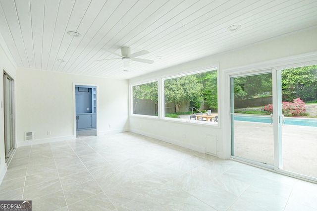 unfurnished sunroom featuring visible vents