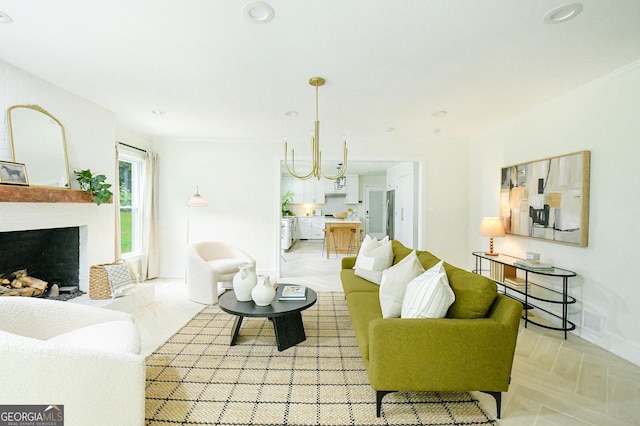 living room with a large fireplace, baseboards, recessed lighting, and visible vents