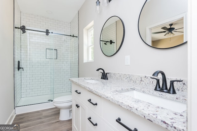 516 Branch St, Cedartown, GA 30125 - full bath featuring wood finished floors, a shower stall, toilet, and a sink