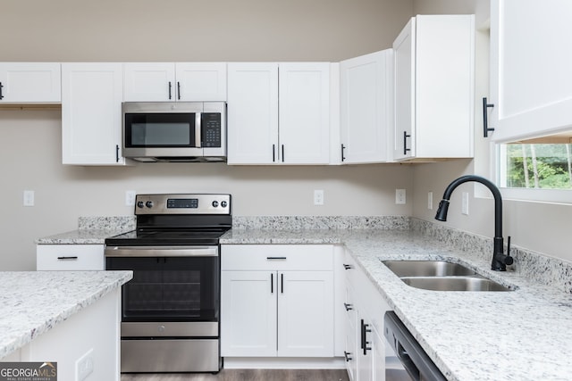 516 Branch St, Cedartown, GA 30125 - kitchen featuring a sink, appliances with stainless steel finishes, and white cabinetry