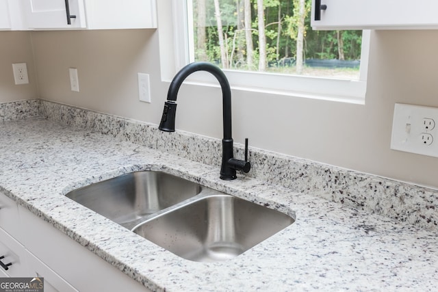516 Branch St, Cedartown, GA 30125 - details featuring white cabinetry, light stone countertops, and a sink