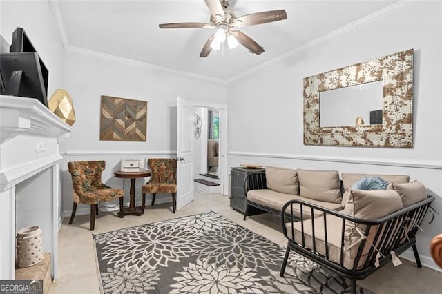 living room with light tile patterned floors, ornamental molding, and ceiling fan