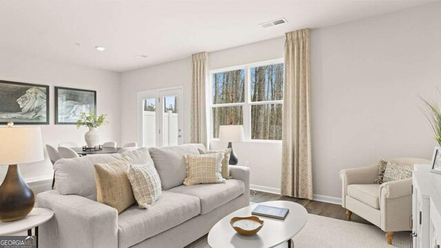 322 Sound Cir Unit 118, Stockbridge, GA 30281 - bedroom featuring recessed lighting, a tray ceiling, visible vents, baseboards, and carpet floors