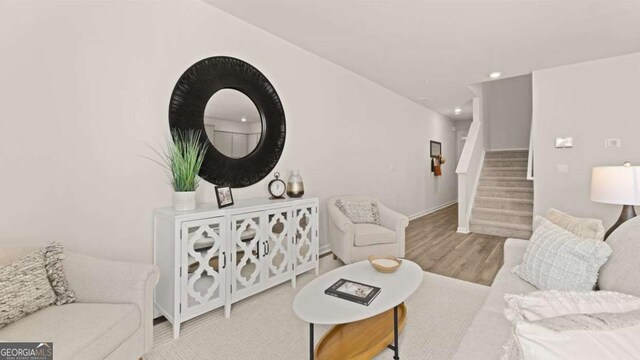 322 Sound Cir Unit 118, Stockbridge, GA 30281 - full bath featuring a sink, a tub, wood finished floors, and baseboards