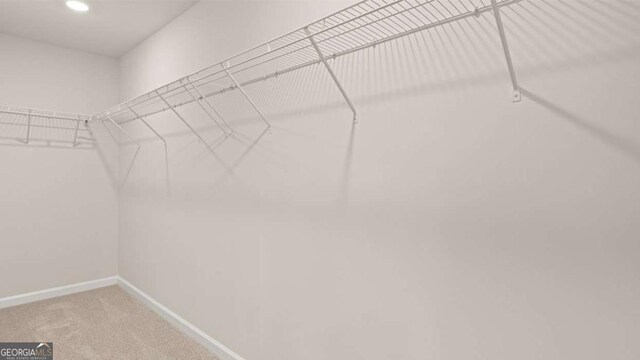 322 Sound Cir Unit 118, Stockbridge, GA 30281 - carpeted empty room with baseboards and recessed lighting