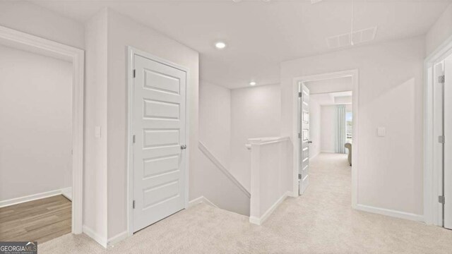 322 Sound Cir Unit 118, Stockbridge, GA 30281 - empty room featuring baseboards, visible vents, light colored carpet, and recessed lighting