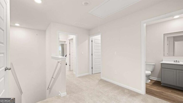 322 Sound Cir Unit 118, Stockbridge, GA 30281 - unfurnished bedroom featuring carpet flooring, a closet, visible vents, and baseboards