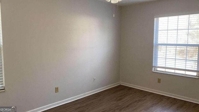 1304 Old Coach Rd SW, Marietta, GA 30008 - spare room featuring dark wood-style flooring, baseboards, and a ceiling fan