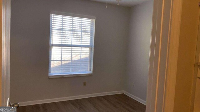 1304 Old Coach Rd SW, Marietta, GA 30008 - unfurnished room featuring baseboards and dark wood finished floors