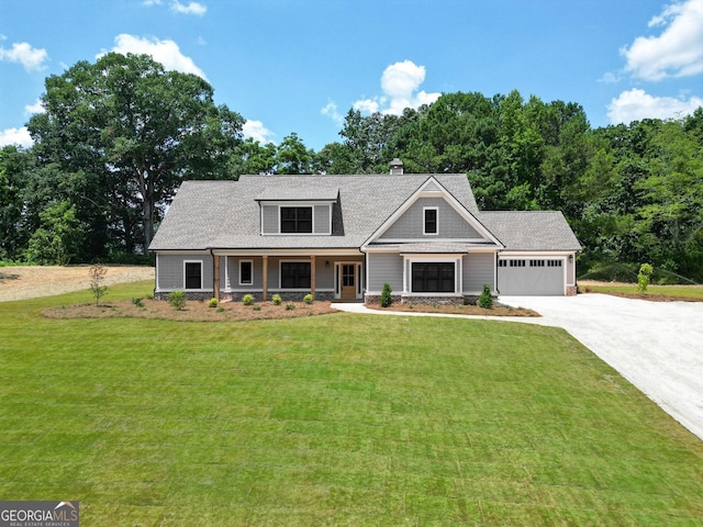 492 Nunnally Farm Rd, Monroe, GA 30655 - craftsman-style home with concrete driveway, an attached garage, a front lawn, and covered porch
