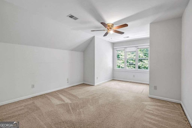 bonus room featuring carpet floors, ceiling fan, baseboards, visible vents, and lofted ceiling