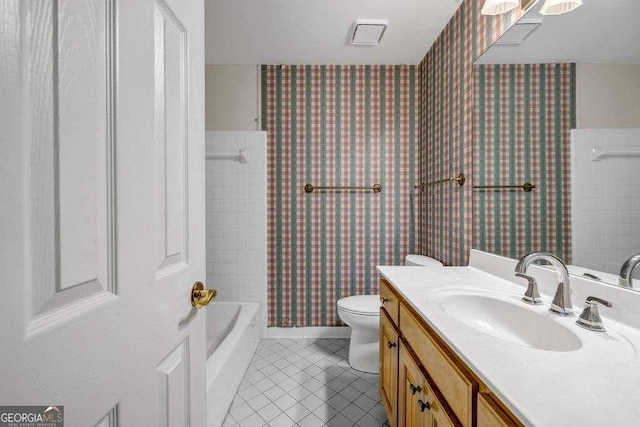 bathroom featuring tile patterned flooring, wallpapered walls, toilet, vanity, and shower / tub combo