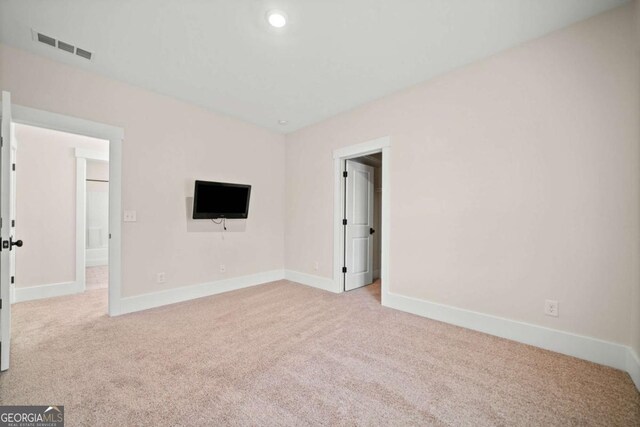 interior space featuring carpet floors, recessed lighting, baseboards, and visible vents