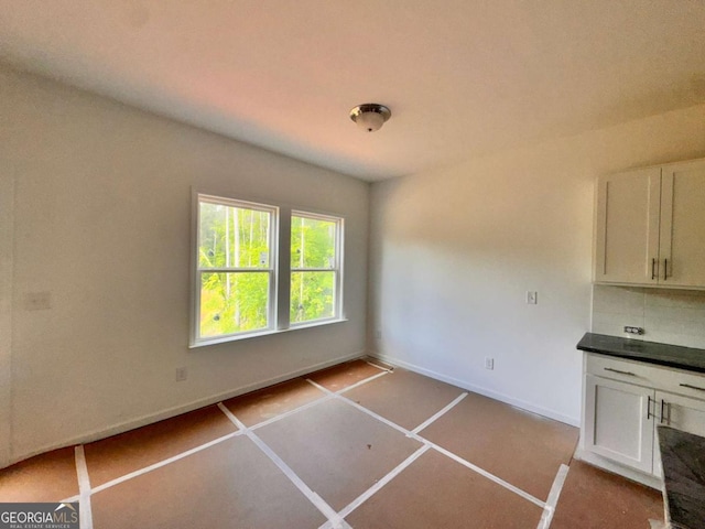 7252 Eton Ln, Locust Grove, GA 30248 - unfurnished dining area with baseboards