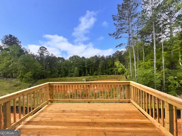 7252 Eton Ln, Locust Grove, GA 30248 - wooden deck with a forest view
