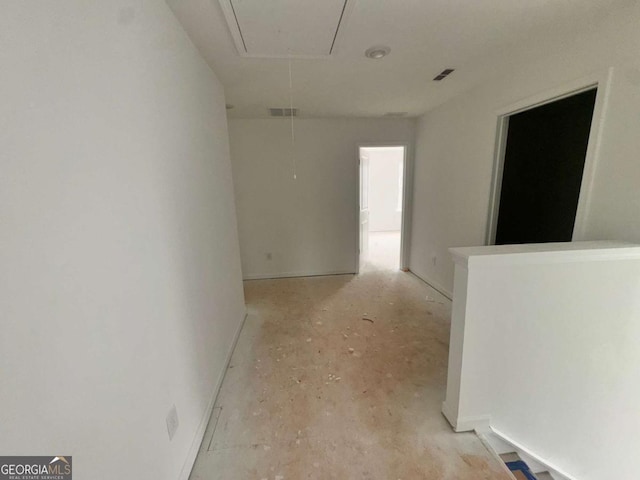 7252 Eton Ln, Locust Grove, GA 30248 - hallway with baseboards, visible vents, and attic access