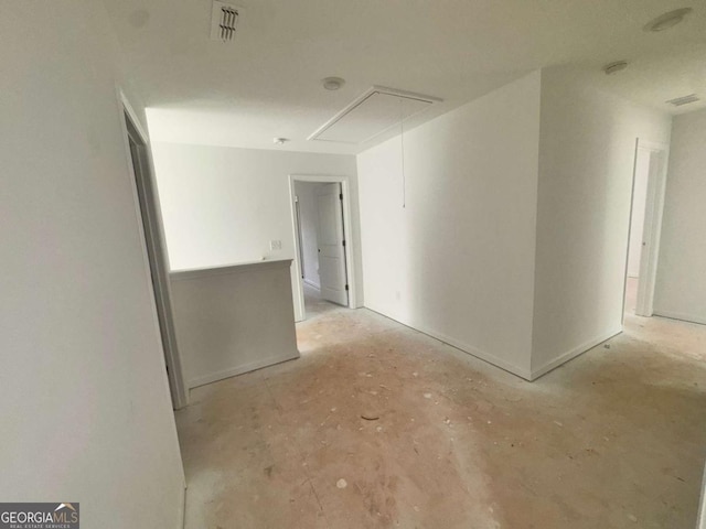 7252 Eton Ln, Locust Grove, GA 30248 - unfurnished room with visible vents, attic access, and unfinished concrete flooring