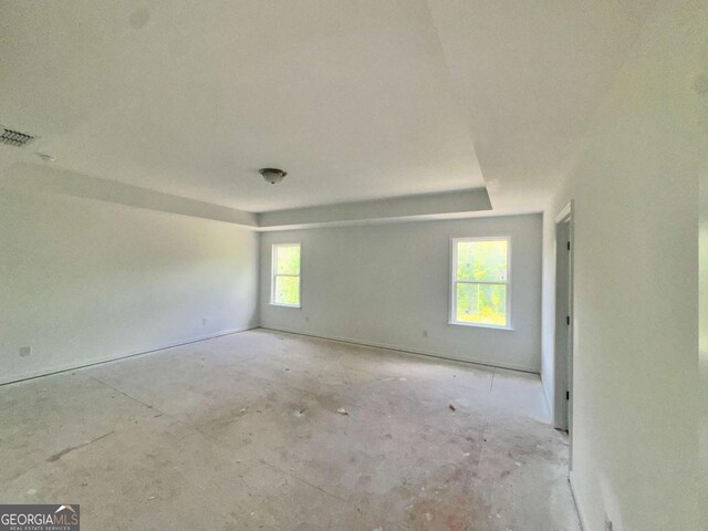7252 Eton Ln, Locust Grove, GA 30248 - empty room with a tray ceiling and visible vents