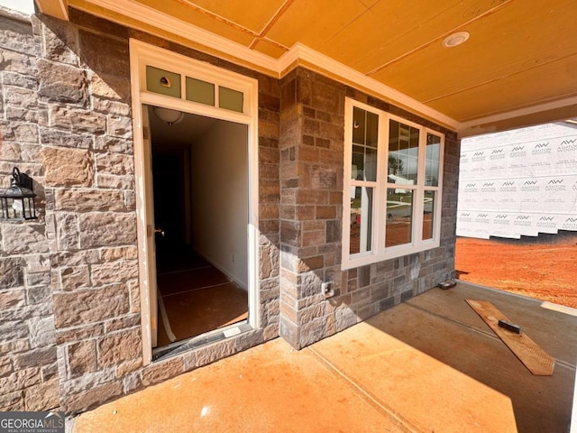 7252 Eton Ln, Locust Grove, GA 30248 - doorway to property with a porch and stone siding