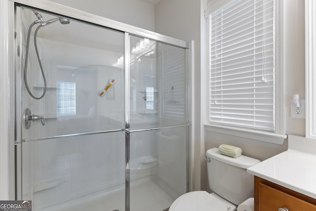 145 Begonia Ct, Griffin, GA 30223 - bathroom with vanity, a stall shower, and toilet