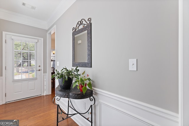 145 Begonia Ct, Griffin, GA 30223 - foyer entrance featuring ornamental molding, wood finished floors, and a wainscoted wall