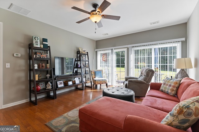 145 Begonia Ct, Griffin, GA 30223 - living area featuring wood-type flooring, a ceiling fan, and baseboards