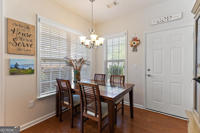 145 Begonia Ct, Griffin, GA 30223 - dining room featuring a chandelier, baseboards, and dark wood-type flooring