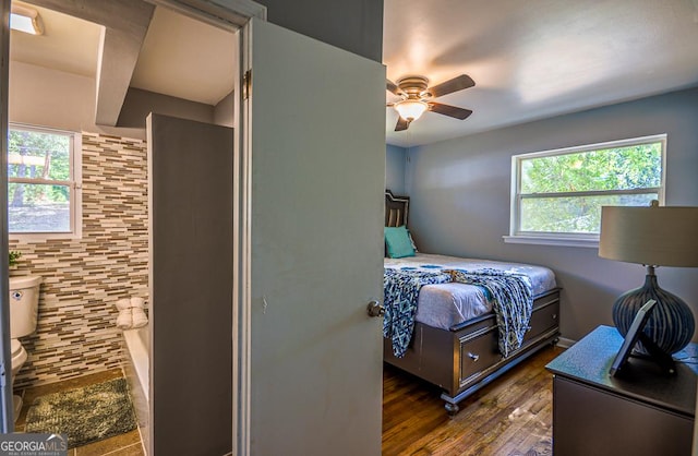 bedroom featuring a ceiling fan and dark wood finished floors