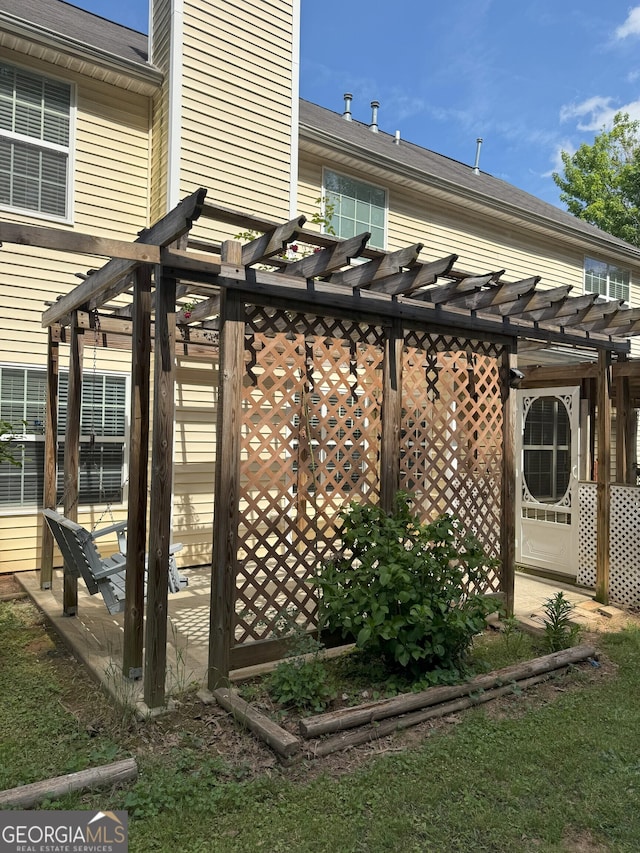 exterior space with a pergola and a chimney
