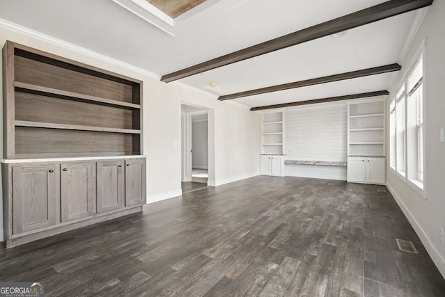 626 Candy Ln, Ellijay, GA 30540 - unfurnished living room with beam ceiling, dark wood finished floors, and built in shelves