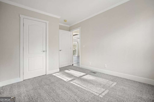 626 Candy Ln, Ellijay, GA 30540 - unfurnished bedroom featuring carpet and crown molding