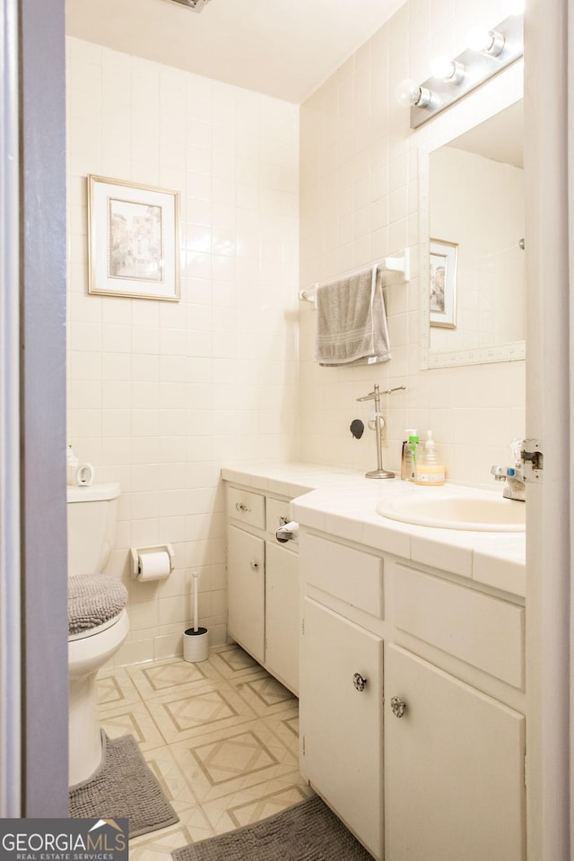 321 N Grove Blvd, Kingsland, GA 31548 - bathroom featuring tile walls, vanity, tile patterned floors, and backsplash