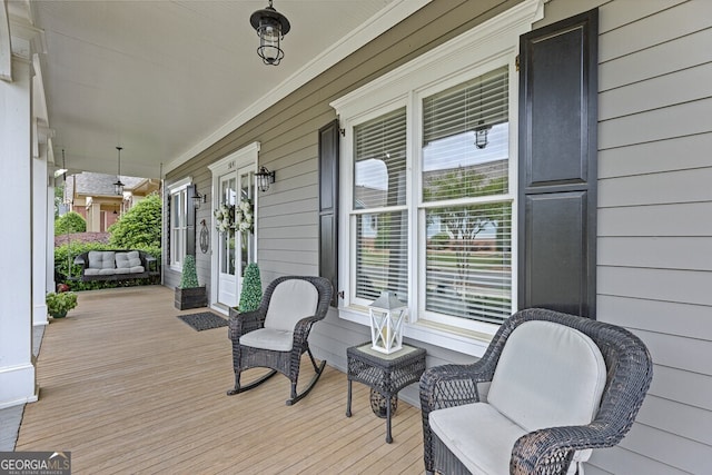5841 Choctaw Ln, Braselton, GA 30517 - wooden deck featuring covered porch