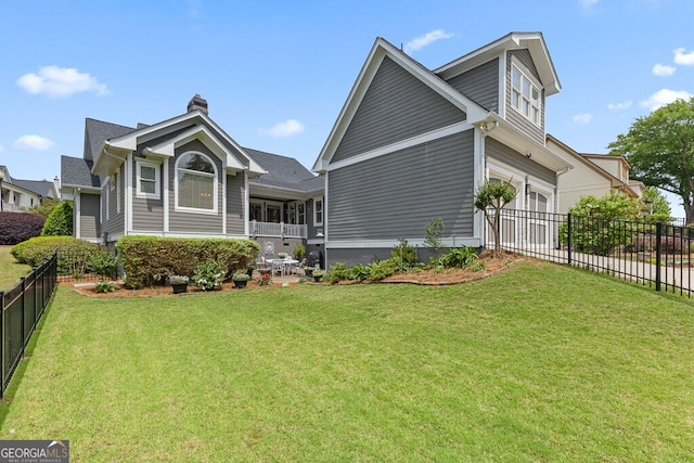 5841 Choctaw Ln, Braselton, GA 30517 - rear view of house with a yard, a garage, and fence