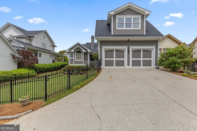 5841 Choctaw Ln, Braselton, GA 30517 - view of front of property featuring concrete driveway, roof with shingles, fence, a front lawn, and a garage