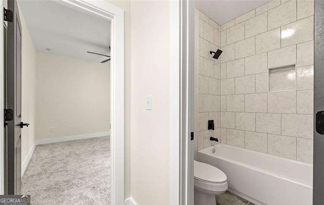 full bath with baseboards, toilet, and shower / washtub combination
