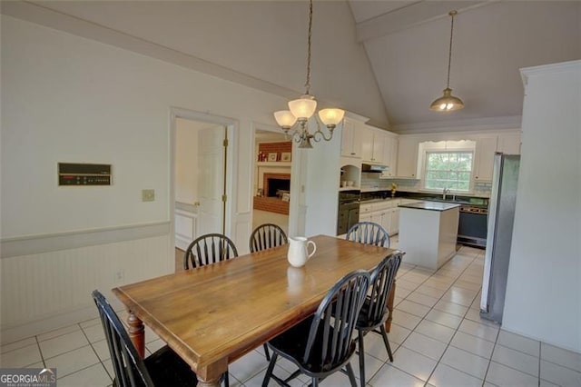 5208 Fox Hill Ct, Peachtree Corners, GA 30092 - dining space with beamed ceiling, light tile patterned floors, a wainscoted wall, a chandelier, and high vaulted ceiling