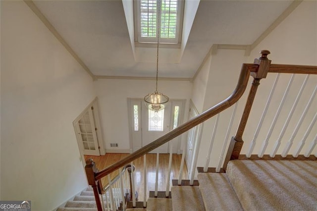 5208 Fox Hill Ct, Peachtree Corners, GA 30092 - stairs with healthy amount of natural light, carpet, a chandelier, and ornamental molding