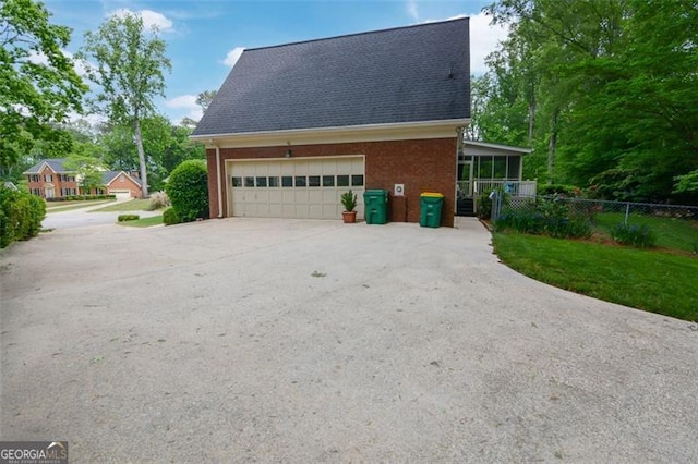5208 Fox Hill Ct, Peachtree Corners, GA 30092 - view of side of property featuring concrete driveway, brick siding, an attached garage, and a shingled roof
