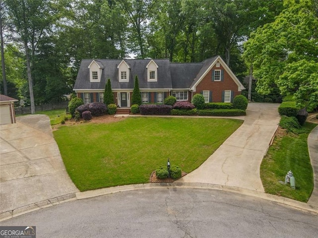 5208 Fox Hill Ct, Peachtree Corners, GA 30092 - new england style home featuring driveway, view of wooded area, and brick siding