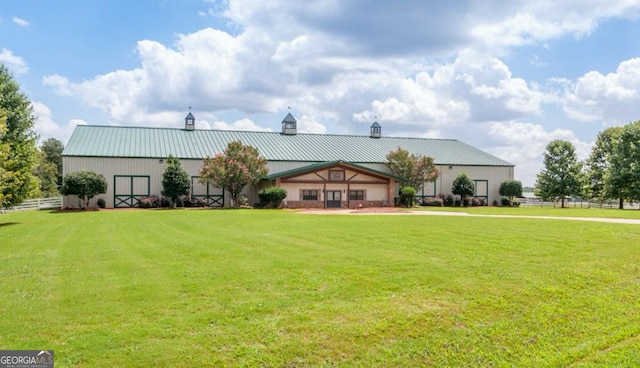 461 Preakness Way, Forsyth, GA 31029 - view of front of home featuring a chimney, a metal roof, and a standing seam roof