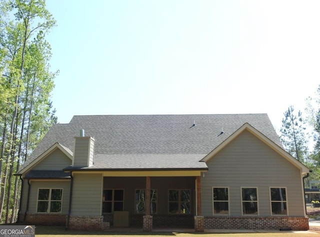 461 Preakness Way, Forsyth, GA 31029 - back of property with a chimney and brick siding