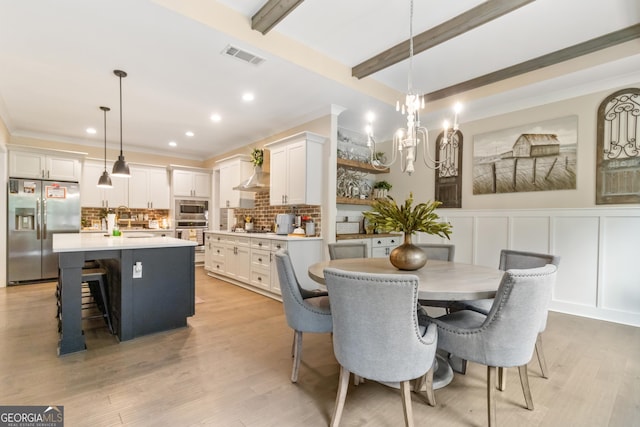 461 Preakness Way, Forsyth, GA 31029 - dining space with a decorative wall, light wood finished floors, recessed lighting, a chandelier, and wainscoting