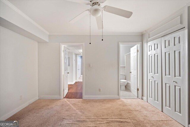 5400 Roswell Rd Unit L3, Sandy Springs, GA 30342 - unfurnished bedroom featuring carpet, ornamental molding, ensuite bath, a ceiling fan, and a closet