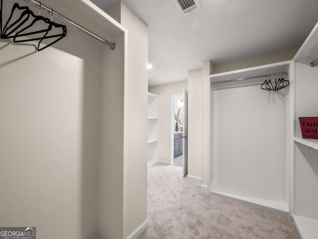 walk in closet with carpet flooring and visible vents