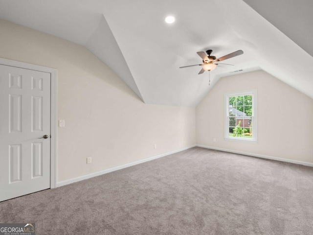 bonus room featuring carpet, a ceiling fan, vaulted ceiling, and baseboards