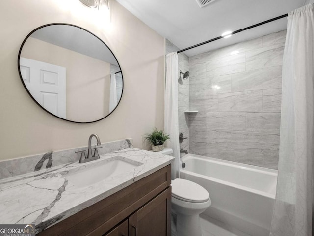 full bath featuring toilet, shower / bath combination with curtain, and vanity