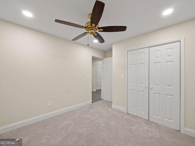 unfurnished bedroom featuring recessed lighting, carpet floors, and baseboards