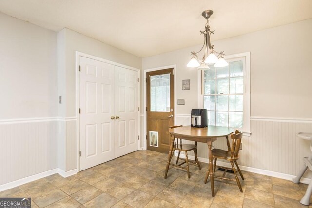 410 Steeplechase, Macon, GA 31204 - dining area featuring stone finish floor, baseboards, and wainscoting