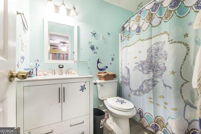 410 Steeplechase, Macon, GA 31204 - bathroom with curtained shower, wood finished floors, toilet, and vanity
